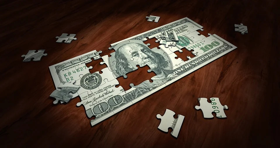 jigsaw puzzle looking like a dollar representing financial planning. business consulting 2
